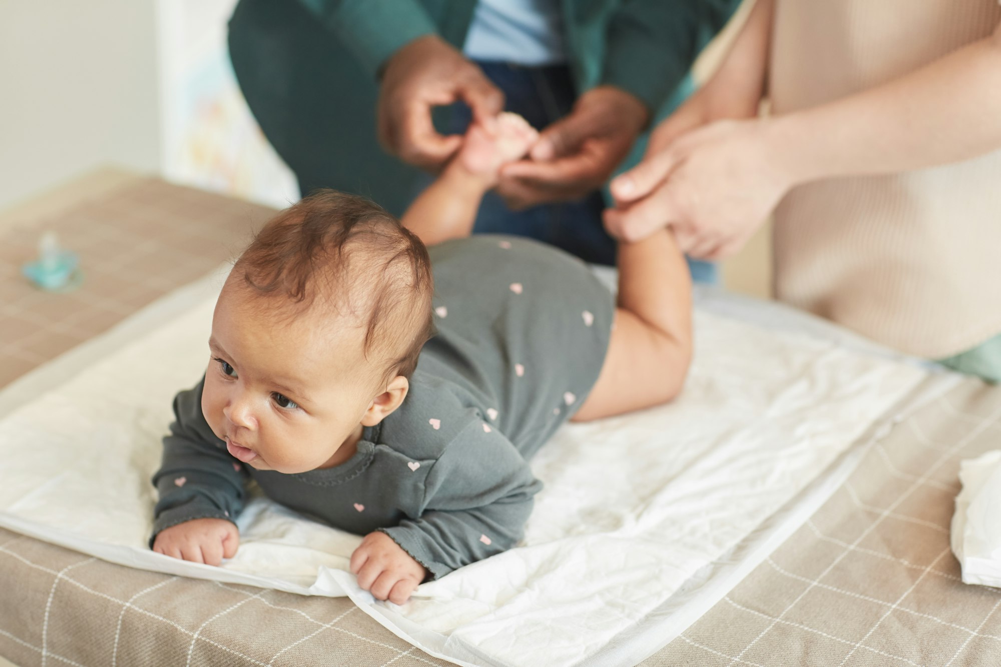 Parents Massaging Baby